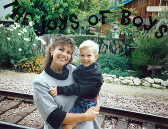 Phil and his mom just getting back from a train trip. He's about 3 years