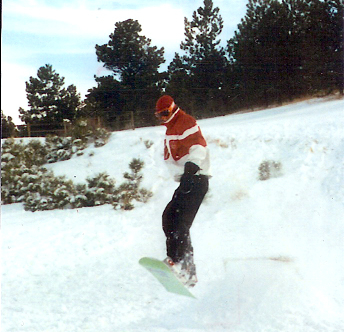 Snowboarding at home and catching some air. November 2004